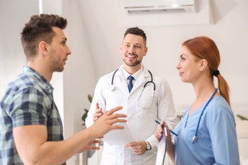 Male patient visiting doctor in clinic