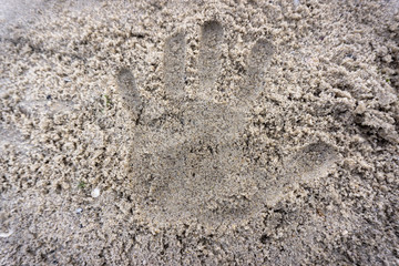 Print on a sand describing current challenging situation aroun the world regarding to corona virus covid-19