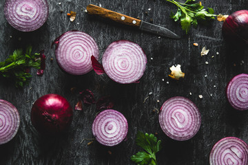 Fototapeta na wymiar onions on black wood table background