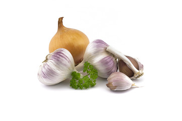 Garlic bulbs, cloves and yellow onion on white