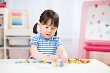 toddler girl learning counting and math for homeschooling