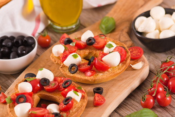 Friselle with tomatoes and mozzarella cheese.
