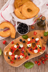 Friselle with tomatoes and mozzarella cheese.
