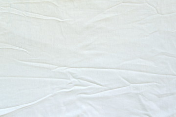 Crumpled white linen fabric cotton for wallpaper design. Brown weave cotton background texture.