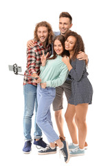 Fototapeta premium Friends taking selfie on white background