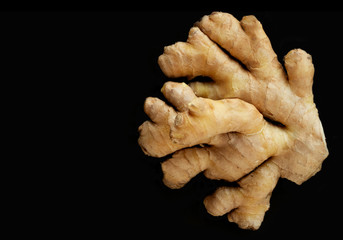 Ginger root close-up on a black background, macro photography