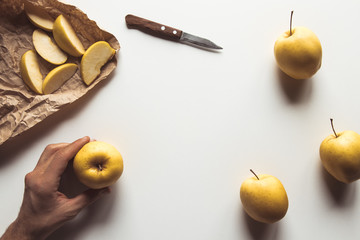 Hand with an apple with a beautiful layout on a white background. Healthy Food, Farm Product, Vegan
