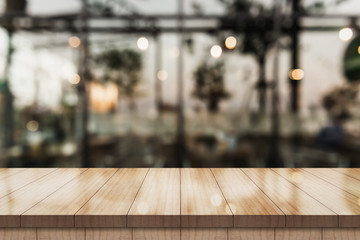 3D Rendering, Wooden top table with bokeh light effect and blur restaurant on background, blur background