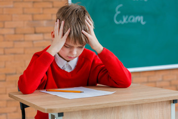 Stressed pupil passing exam at school