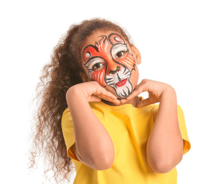 Funny African-American girl with face painting on white background