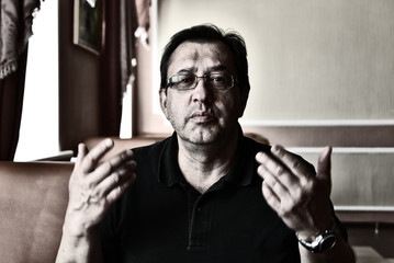 The man convinces the interlocutor. Monochrome