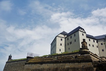 Koenigstein fortress and part of the surrounding wall in front of sky