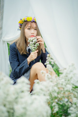 Beautyful Asian woman in the flower garden
