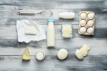 Different dairy products on wooden background