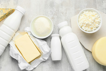 Different dairy products on grey background
