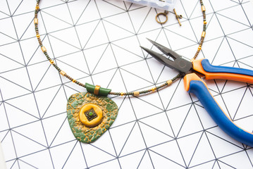 Handmade jewelry design of bohemian necklace. Working process.