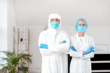 Receptionist with doctor in hall of clinic