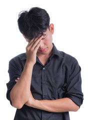 A young man in a long black shirt is worried about something isolated on white background.