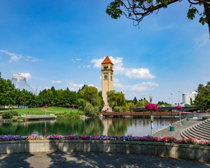 the Spokane River with the clock tower, bridge and downtown visible in Riverfront Park, Spokane Washington.