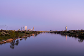 Obraz premium Vienna near river Danube on a clear evening in spring