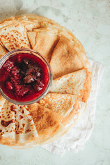 Pancakes are a dish of Russian, German, Caucasian cuisines baked from batter in a frying pan.the frying pan