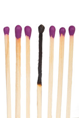 Burned matches over white