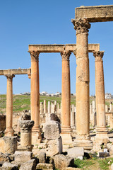 Fototapeta premium Columns and wall of ruined Greco-Roman city, Jordan