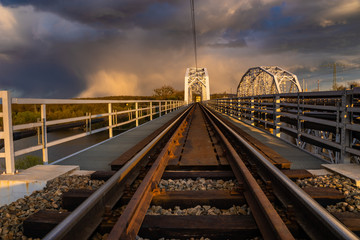 railway bridge against the backdrop of heavy storm