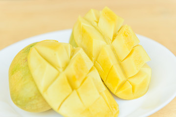 Ripe mango in the white dish