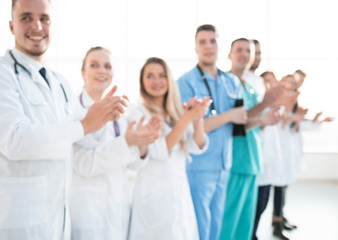 Obraz na płótnie Canvas group of diverse medical staff members applauding together