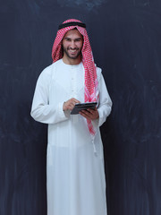 young arabian muslim businessman using tablet computer