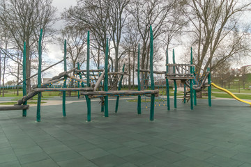 Outdoor sports ground. Ppassage of the wall obstacles. Children's play complex on an open sports field in early spring