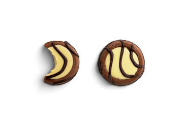 Chocolate cookies with milk filling isolated on white background.