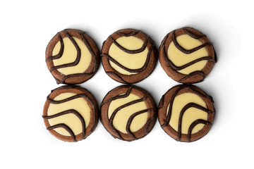 Chocolate cookies with milk filling isolated on white background.