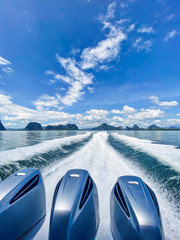 The waves on water surface behind of fast moving motor boat engine, view on water surface behind of...