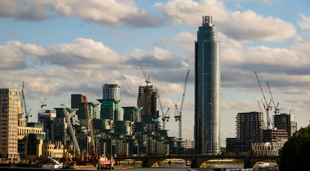 View of the Vauxhall tower and city buildings along the River Thames in London