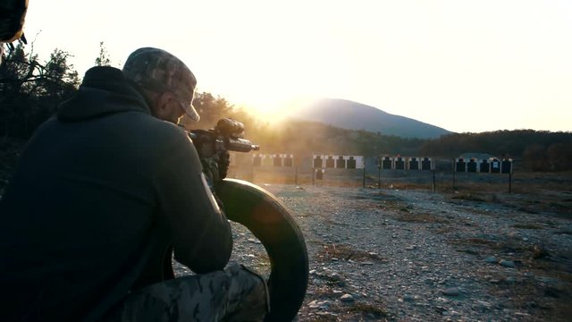 A military specialist from a special forces unit shoots at a tactical range from the AR-15