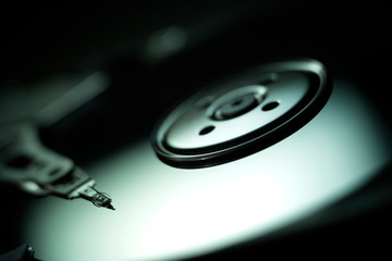 Hard Disc Drive view from the inside with reflections. HDD internal parts. PC hardware. Open HDD.