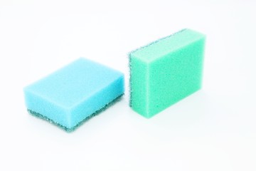 Sponges for washing dishes located on a white background