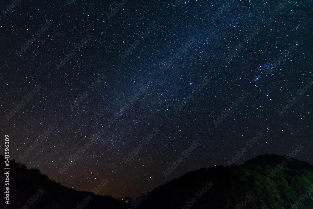 Wall mural stars at night in the sky for background