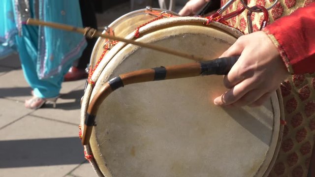 Close up shot of percussion during Indian wedding taking place outdoors