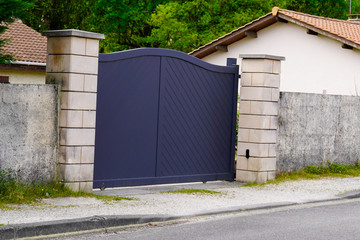 Aluminum gray metal gate house portal door of suburb access home