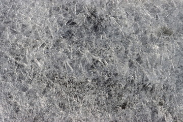 Сracked ice background. Frozen water. Ice on the beach