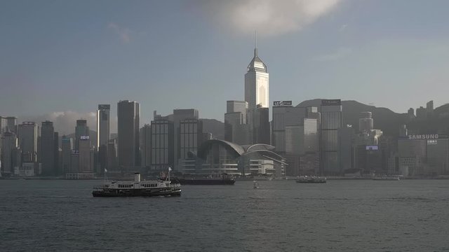 Traditional Ferry passing in front of Hong Kong Central Plaza