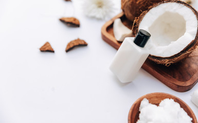 Organic healthy coconut over white background, body care products