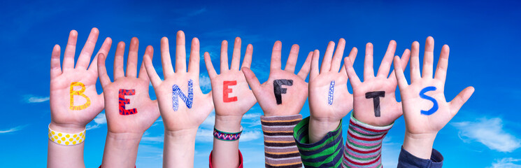Children Hands Building Colorful Word Benefits. Blue Sky As Background