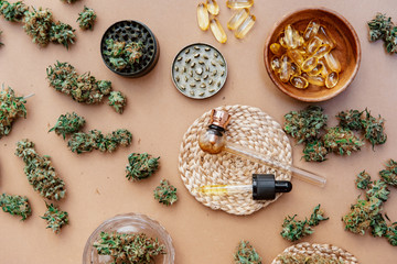 Medical marijuana buds with oil and glass pipe. Top view, flat lay