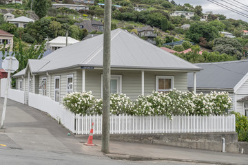 blossoming sundeck of traditional house on uphill street at Lyttleton, Cristchurch, New Zealand