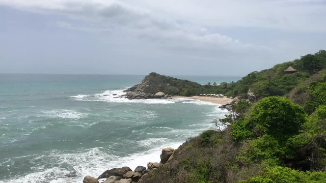 View of a private beach in a Colombian hotel resort. Panoramic shot of Caribbean beach in the Tayrona National Park.