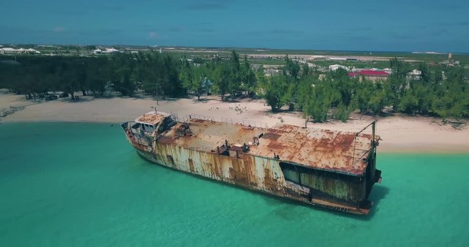 4k - Drone shots of the Mega One Triton ship beached on Governor's Beach in Grand Turk, Turks & Caicos Islands - Clip #1